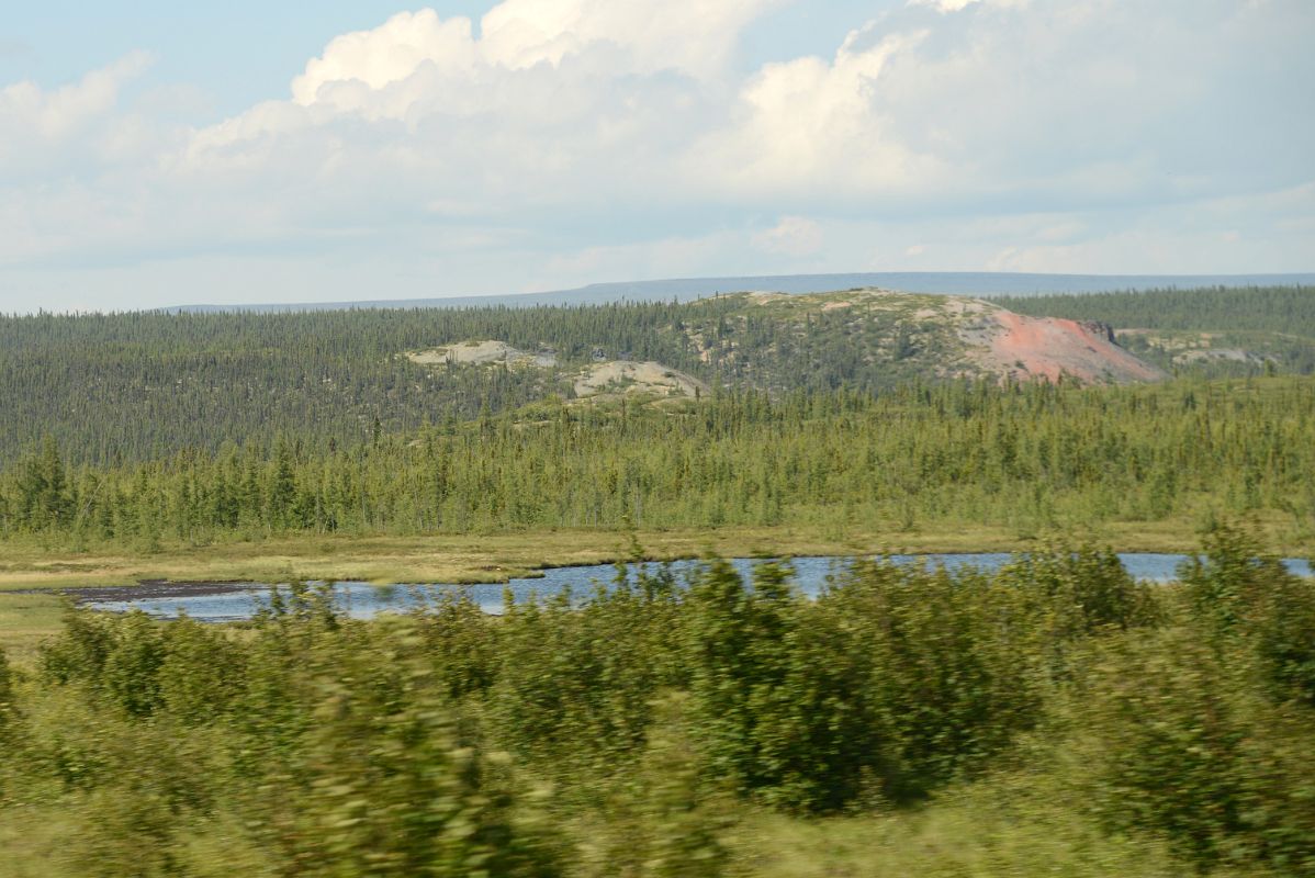23A Hill With Exposed Pink Soil Next To Dempster Highway In Yukon Between Yukon Border And Arctic Circle